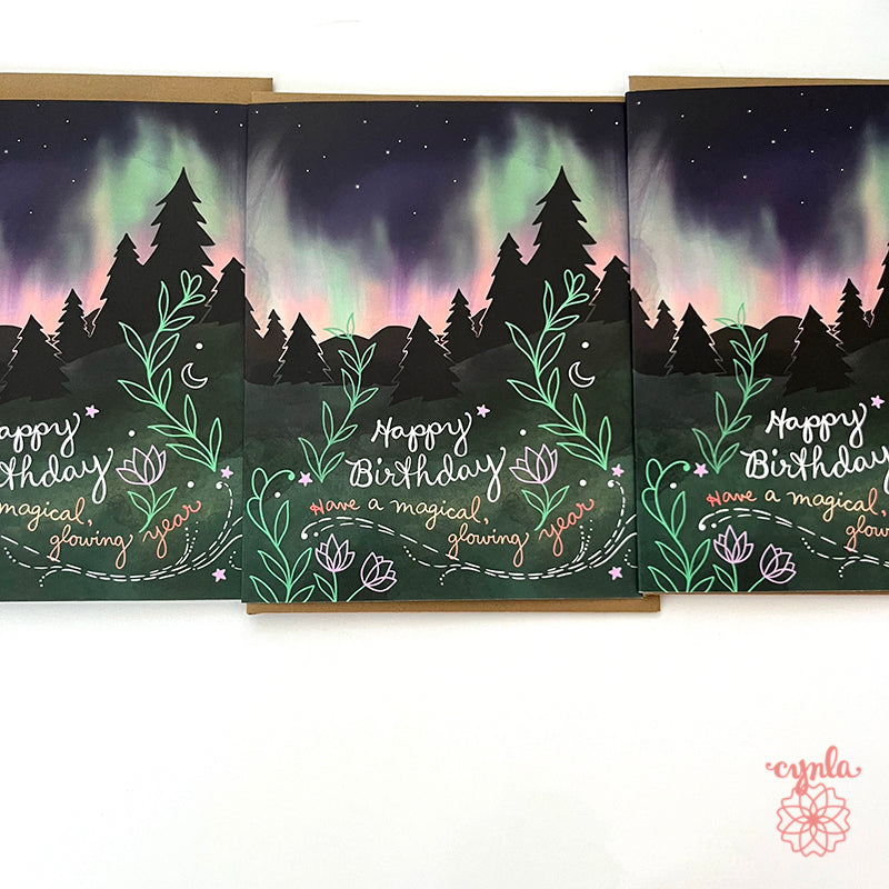 birthday cards with Northern Lights design and 'Happy Birthday' text. aurora greeting card magical nature art by Cynla - Cindy LaColla copyrighted art celestial designs