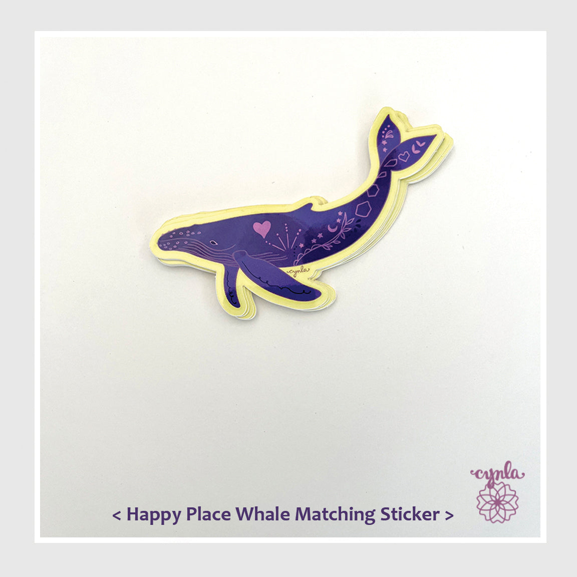 Purple whale sticker with decorative elements on a white background